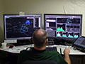 Click to see an image of a controller behind a workstation in a New York Operational Improvements simulation