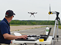 Click to see an image of a UTM team members launching a vehicle for a flight test